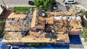 Roof replacement in Pueblo, CO showing damaged shingles removed after hail and weather damage.