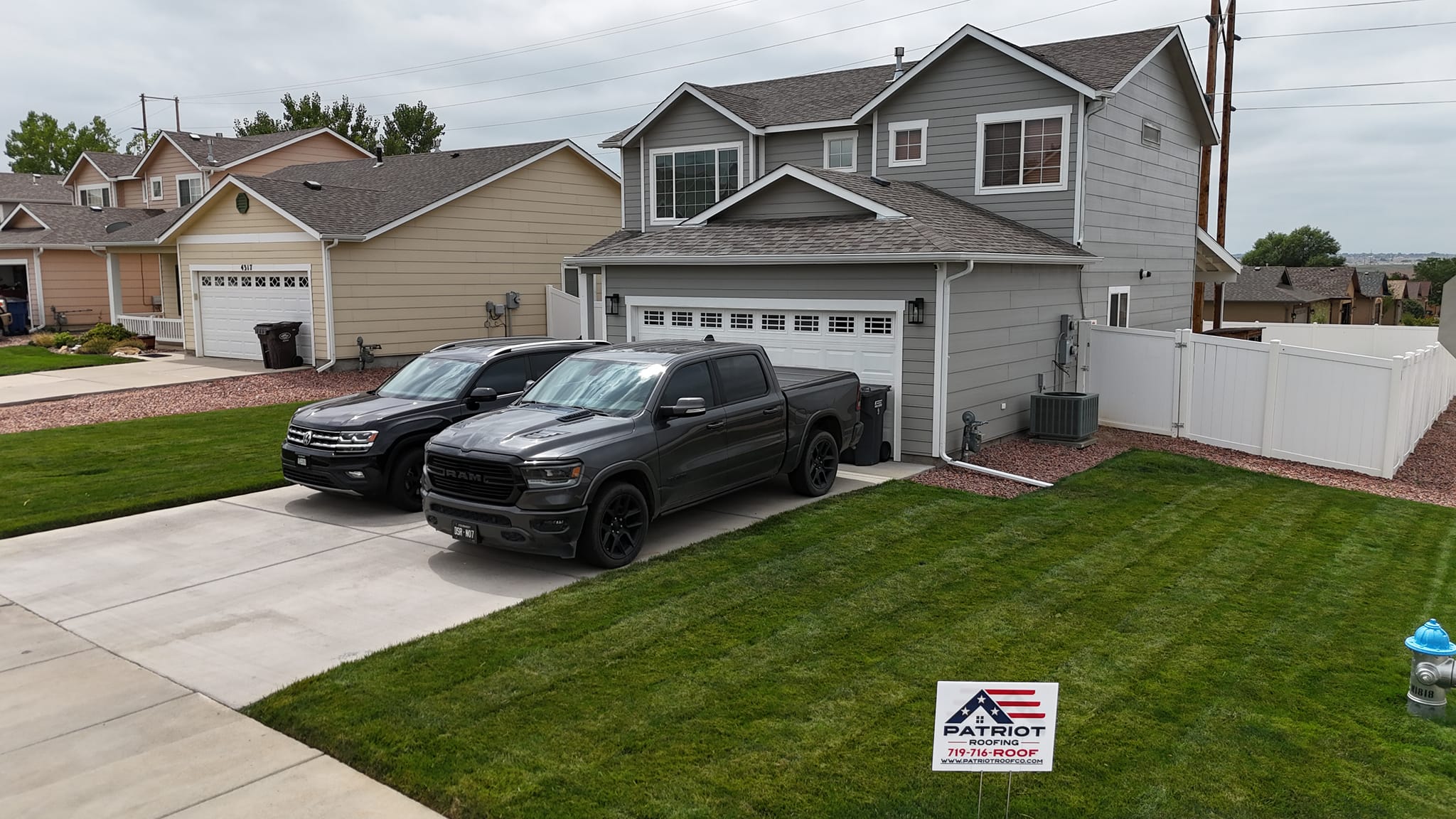 Trusted roofing contractor in Pueblo CO completing a residential roof replacement on a two story home.