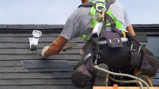 Patriot Roofing crew installing a new shingle roof, Pueblo CO replacement